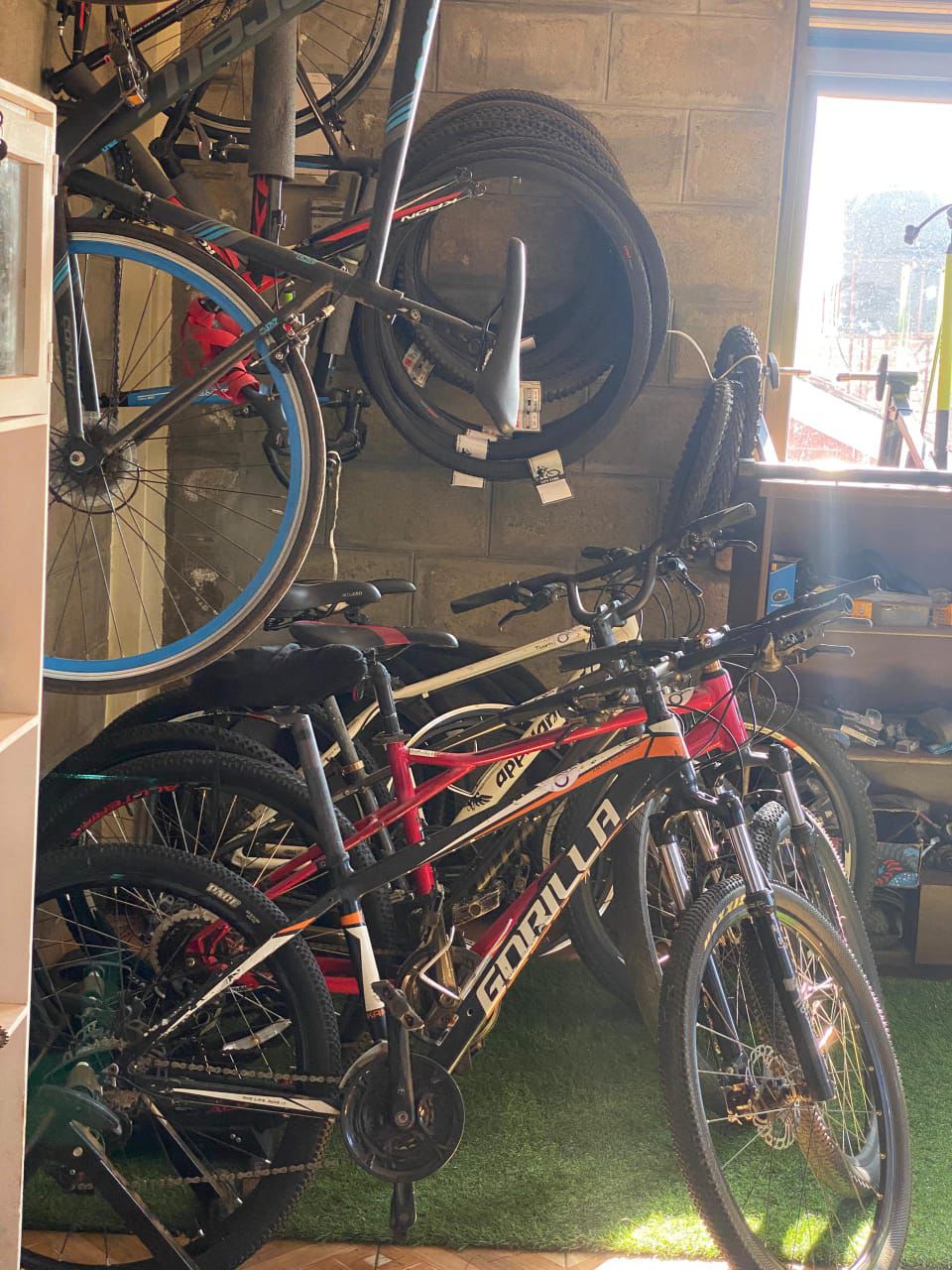 Bikes for sale racked up inside the workshop showroom